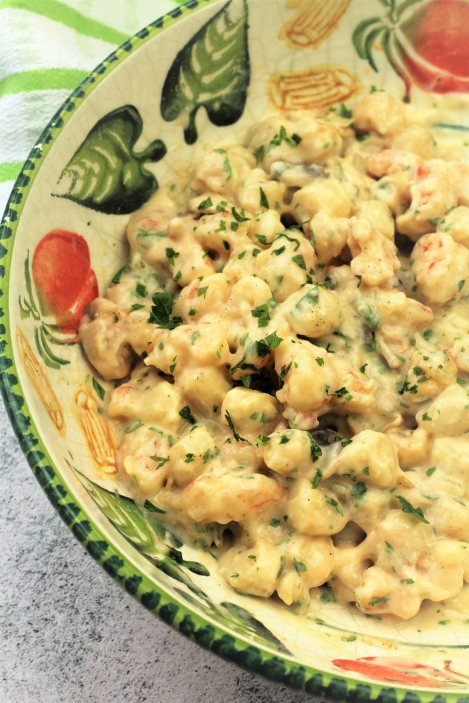 seafood mixture with bechamel sauce in large bowl