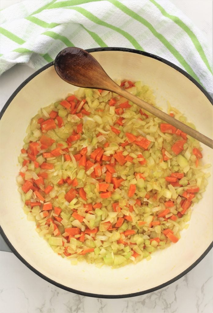 skillet with sautéed carrots, celery and onions