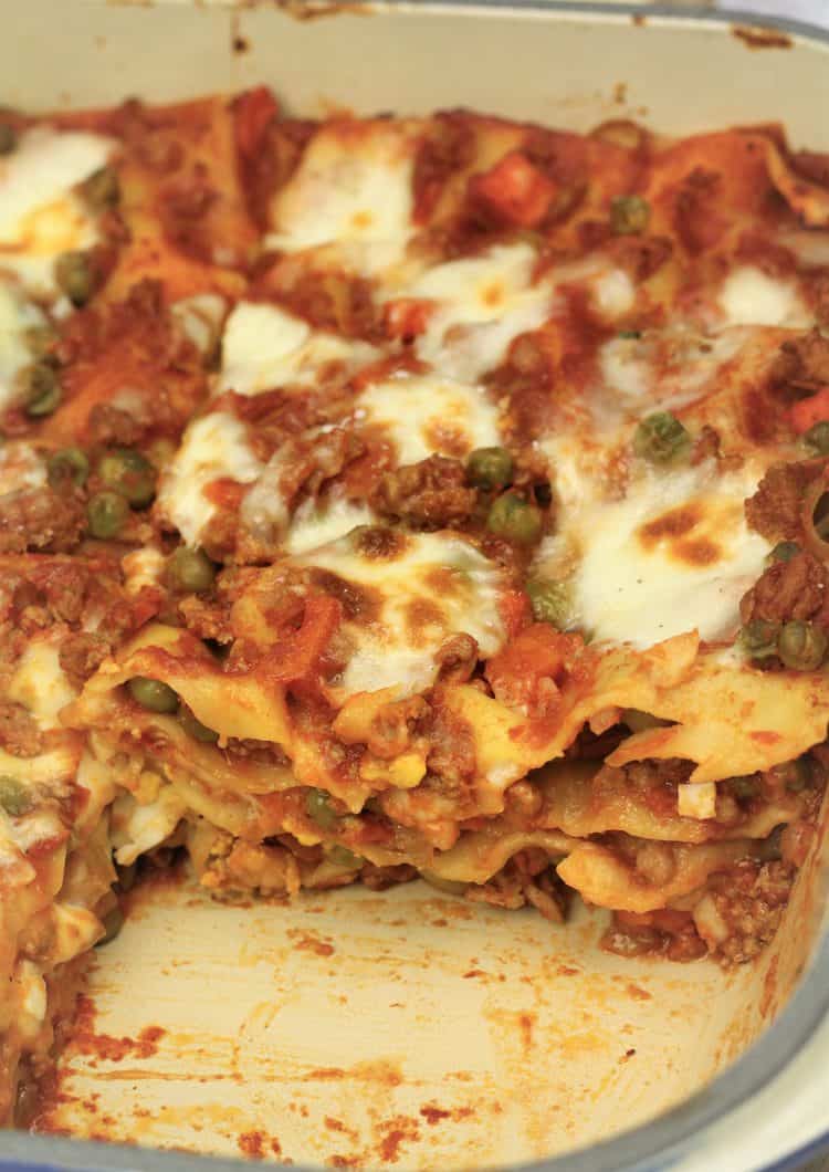 sicilian lasagna in pan with slice removed