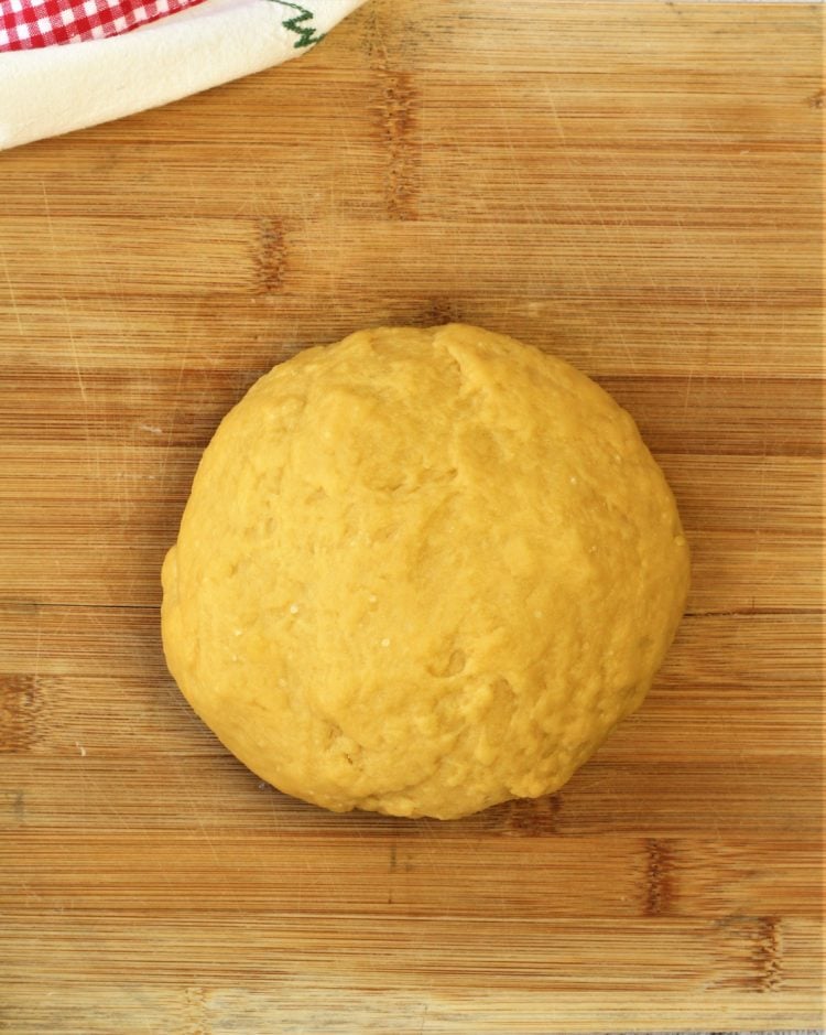 ball of dough for pignolata on wood board