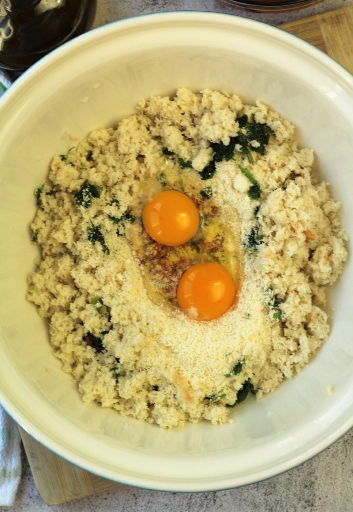 meatball mixture with eggs in large mixing bowl