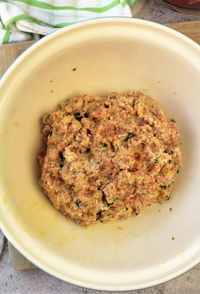 raw meatball mixture in mixing bowl