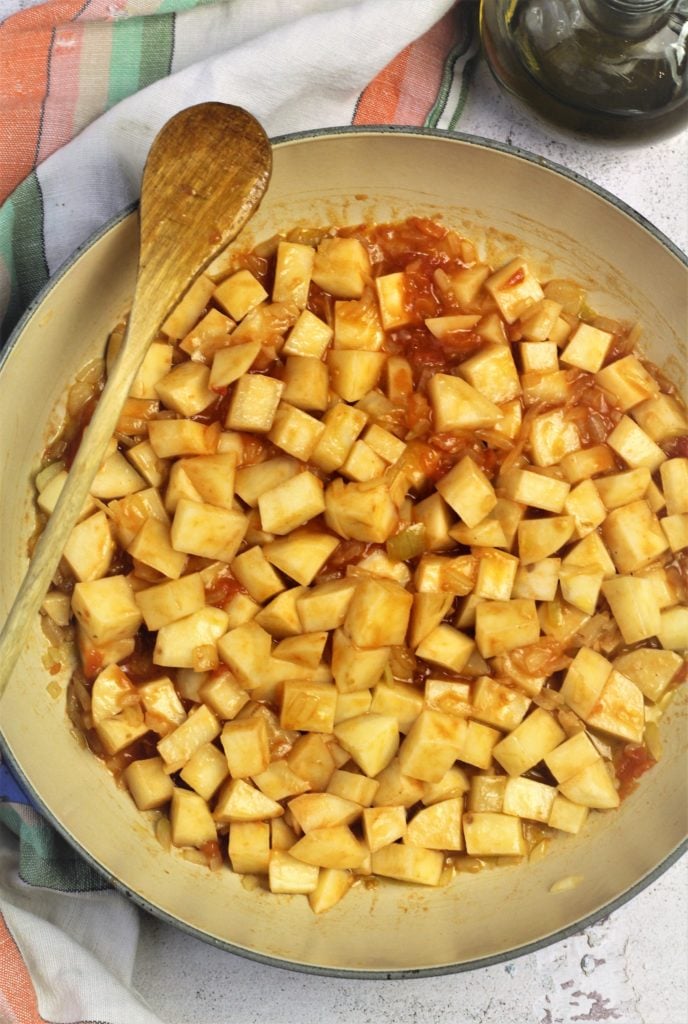 cubed potatoes, tomato and diced onion in large skillet