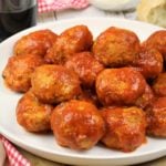 meatballs in tomato sauce piled on serving plate