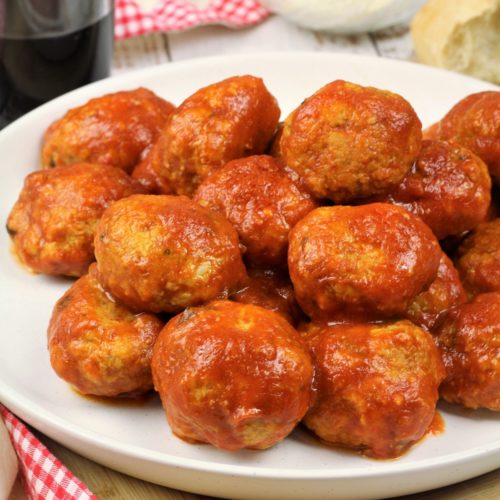 meatballs in tomato sauce piled on serving plate
