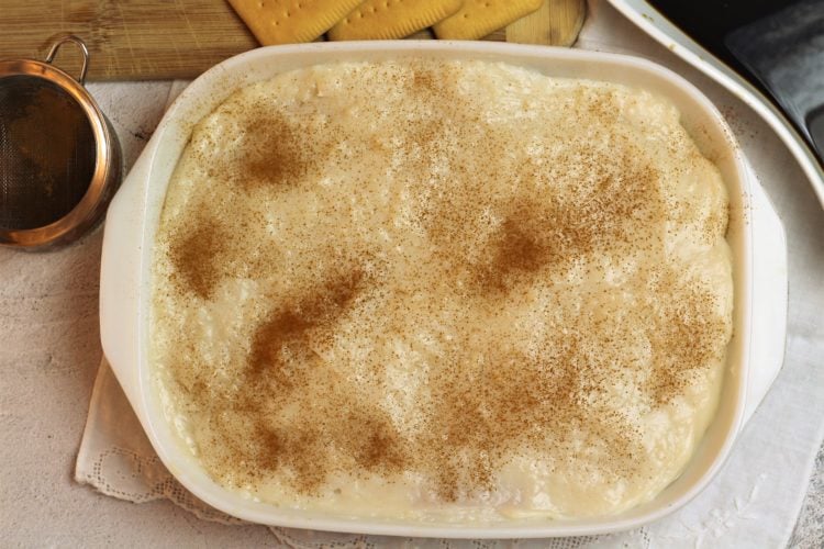 cream dusted with cinnamon in baking dish