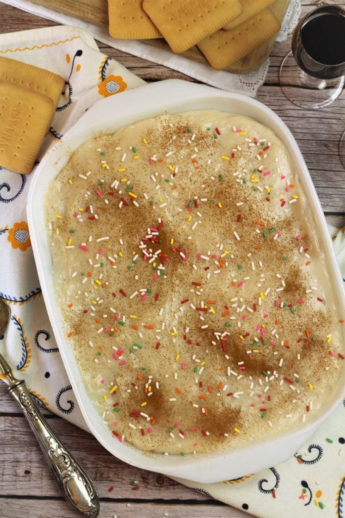 baking dish filled with cookies and cream topped with cinnamon and candy sprinkles