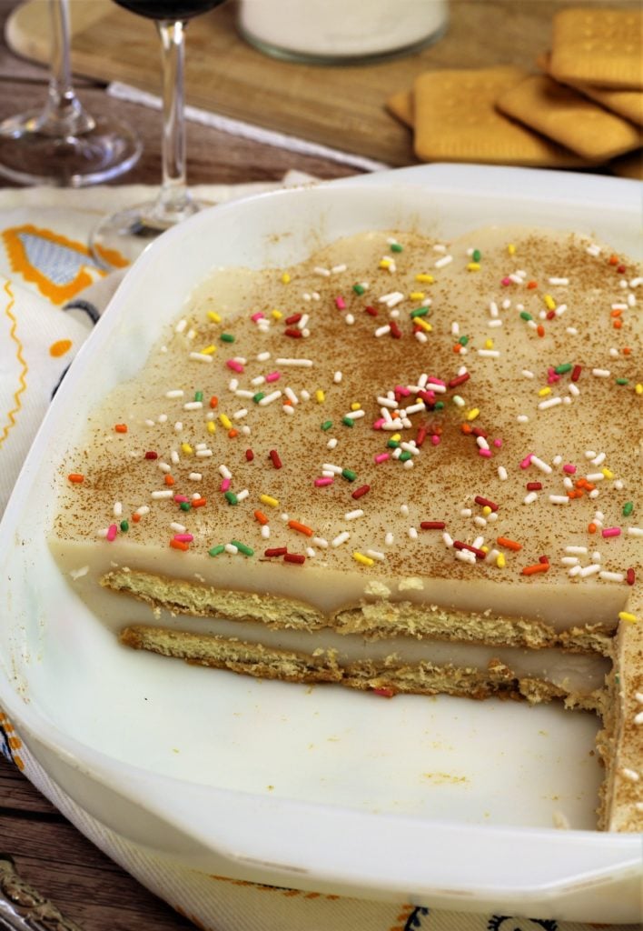 layered cookies and milk pudding in baking dish