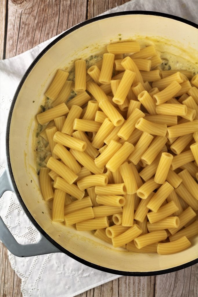 large skillet filled with pasta in pistachio sauce