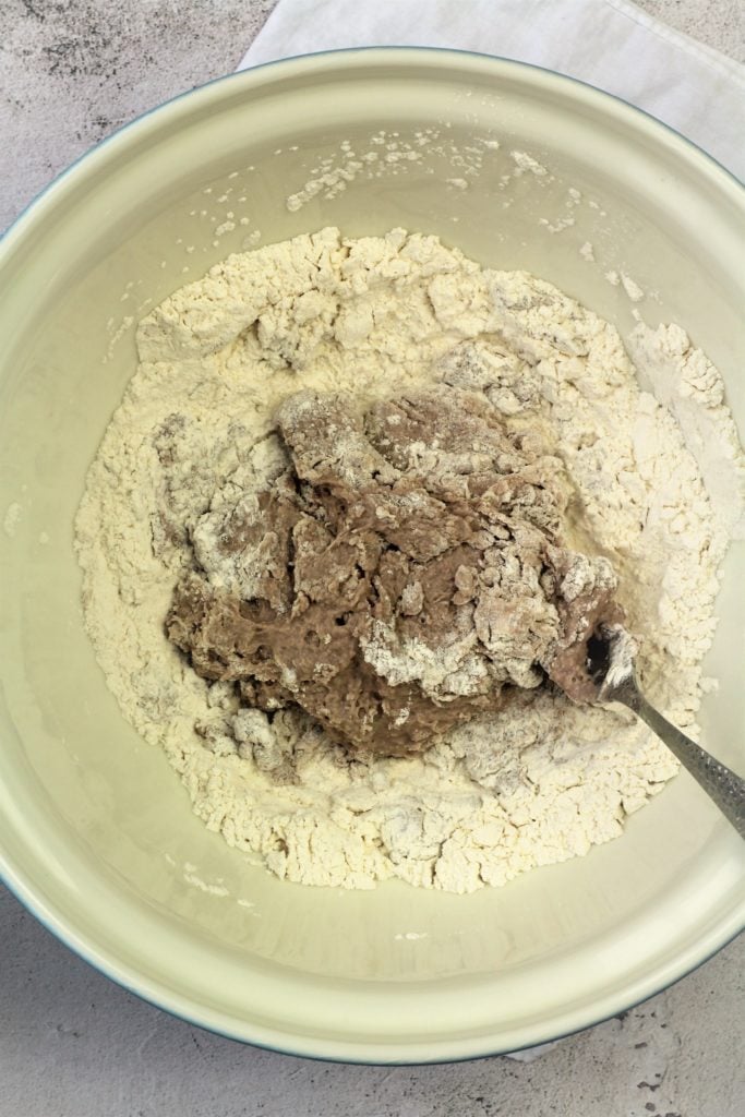 cannoli dough with red wine stirred with fork in large bowl