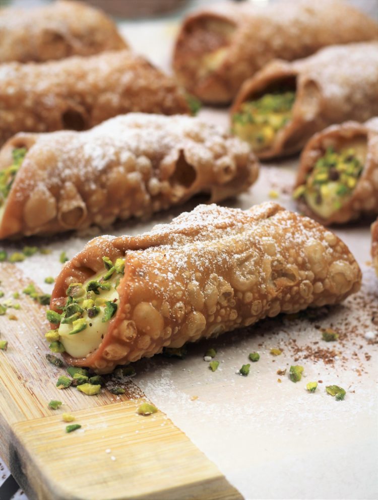pistachio topped pastry cream filled cannoli