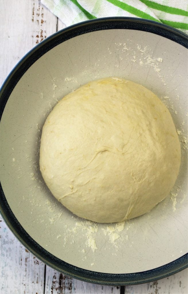 ball of pizza dough in bowl