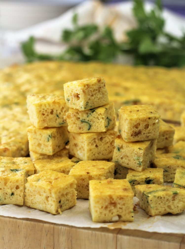 cubes of frittata piled for zuppa imperiale
