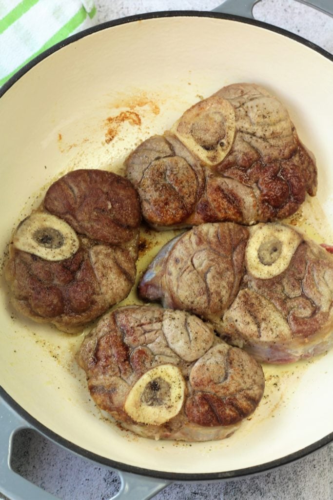 veal osso buco pieces browned in skillet
