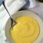 bowl of creamy polenta with spoon