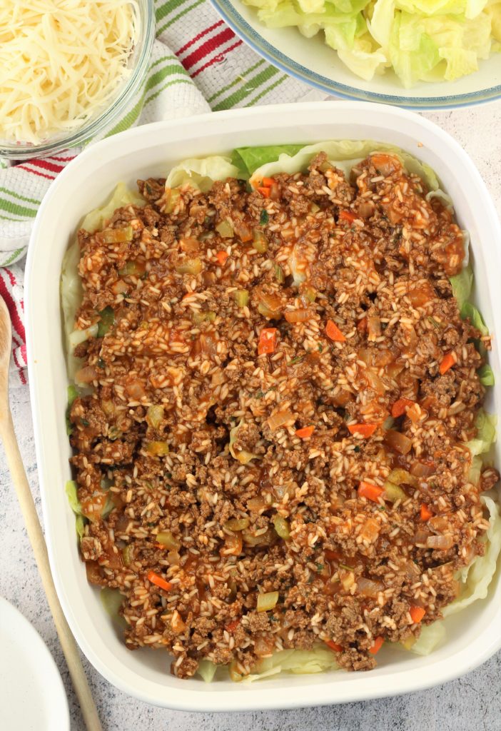 ground beef, tomato and rice mixture in baking dish