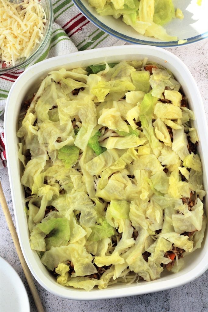 strips of cabbage over beef mixture in baking dish