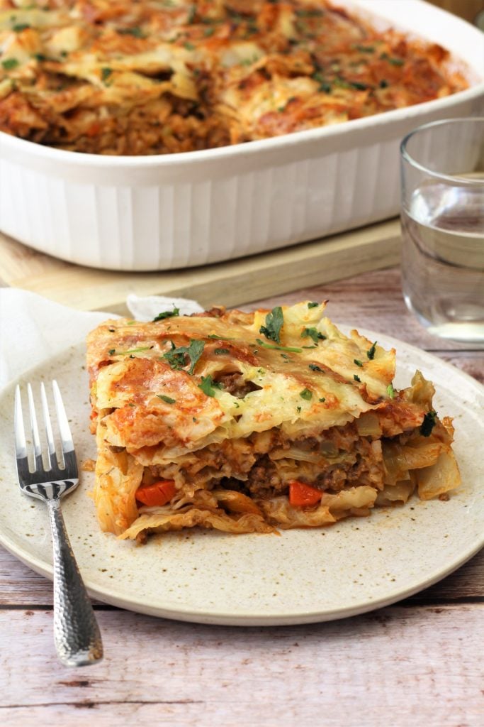 square of unstuffed cabbage roll casserole on plate with fork