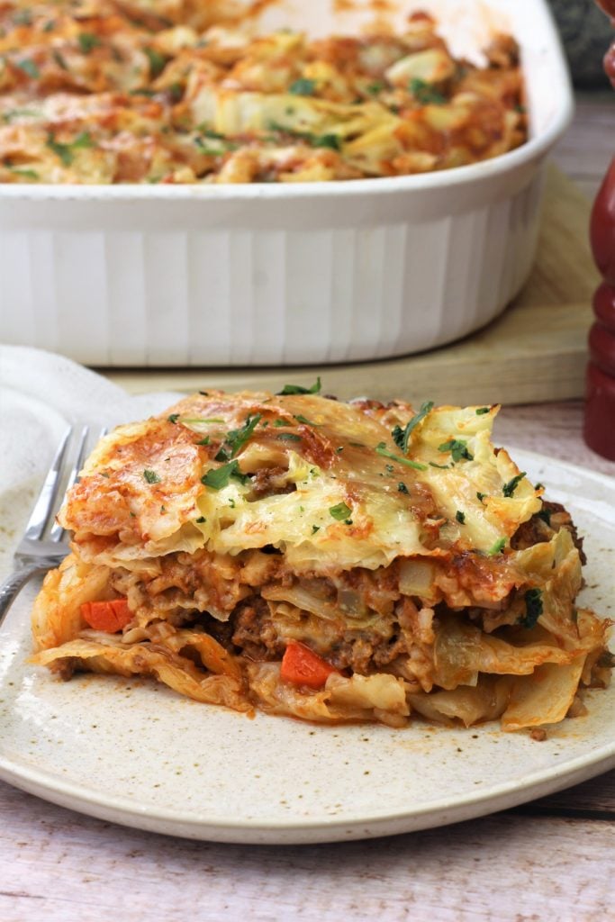 cabbage roll casserole piece on plate with fork