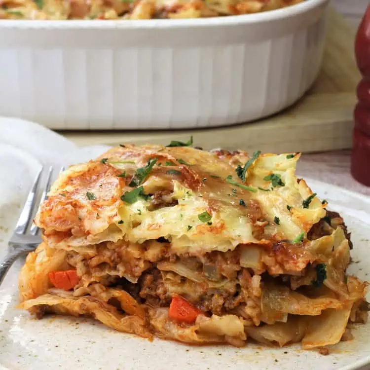 wedge of cabbage roll casserole on plate with fork