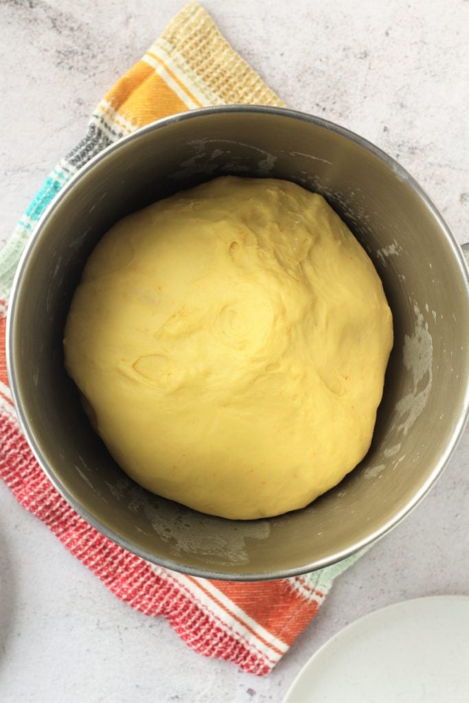 Proofed brioche dough in food procecssor bowl.