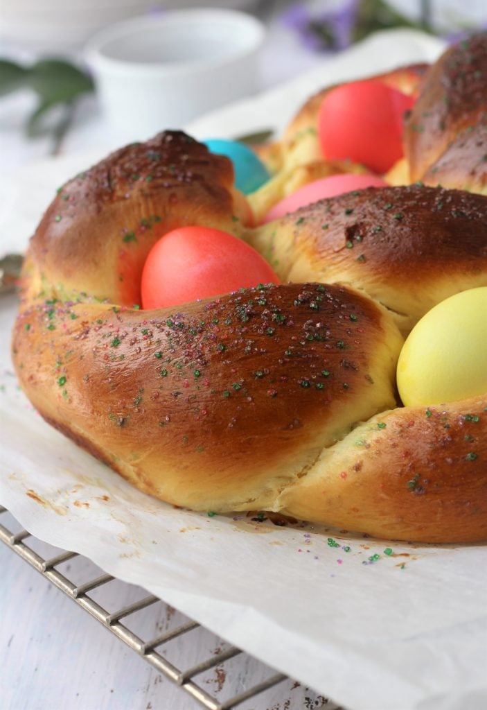 Braided Italian Easter bread with colored eggs.