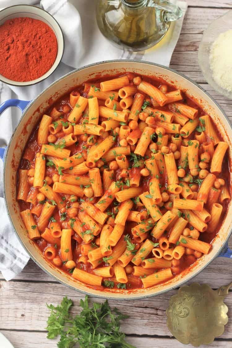 Pasta with chickpeas and tomato sauce in large skillet.