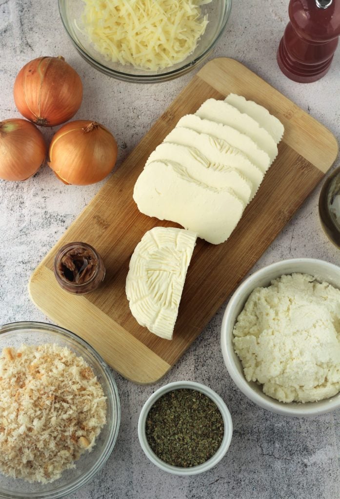 Cheeses, breadcrumbs, oregano, onions, anchovies.