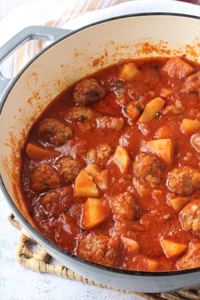 Stewed meatballs and potatoes in sauce.