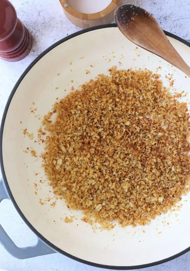 Crispy breadcrumbs in pan.