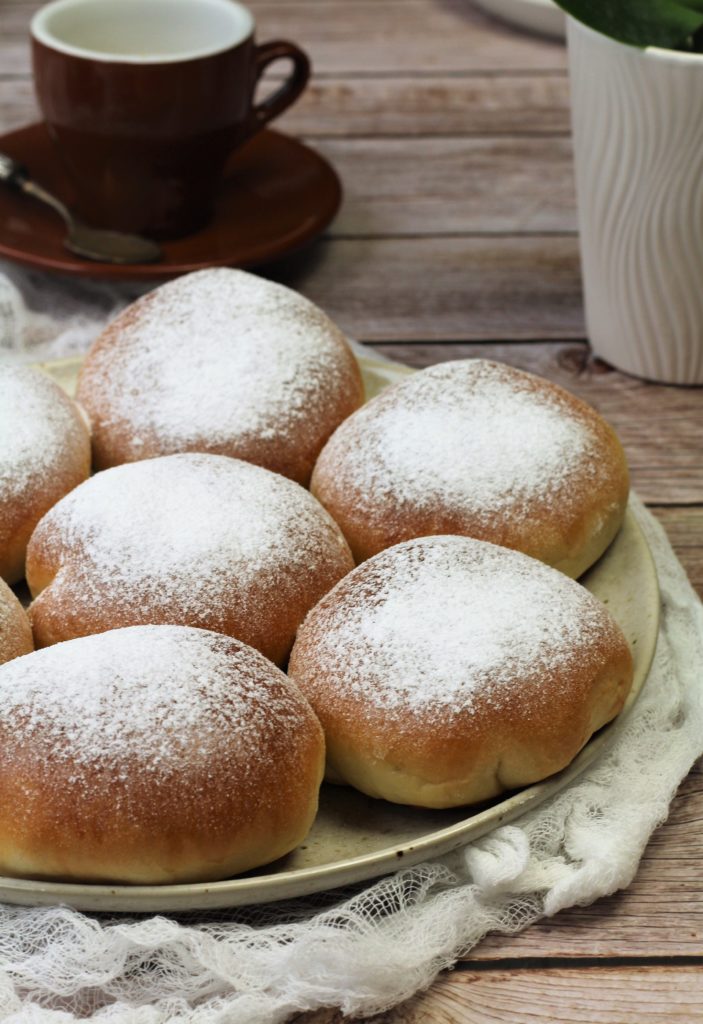 Iris with ricotta buns on plate.