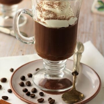Sicilian coffee pudding, gelo di caffè, in glass with whipped cream.