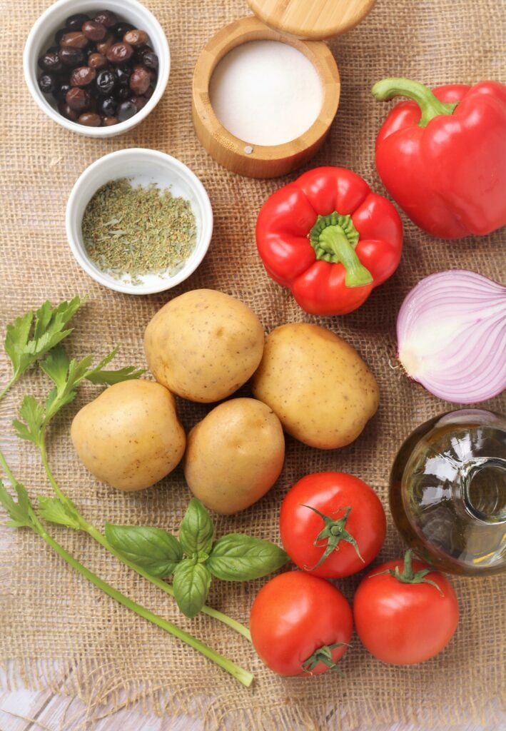 Olives, salt, oregano, red ppers, potatoes, red onion, olive oil, tomatoes, basil and celery.