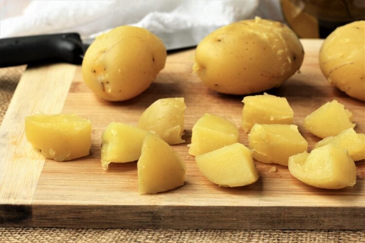 Peeled boiled potatoes cut into cubes.