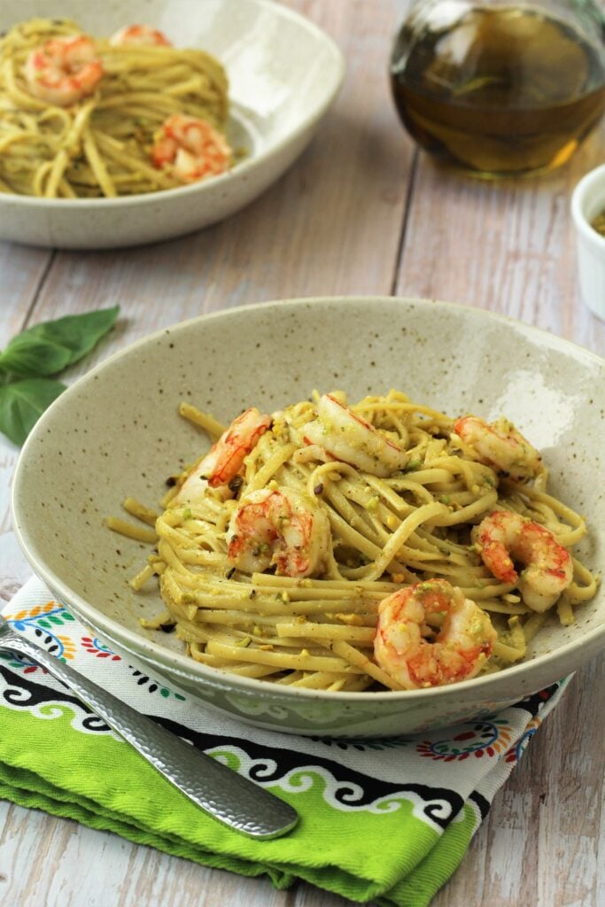 Plated pesto shrimp pasta.