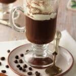 Sicilian coffee pudding (gelo di caffè) in glass topped with whipped cream.