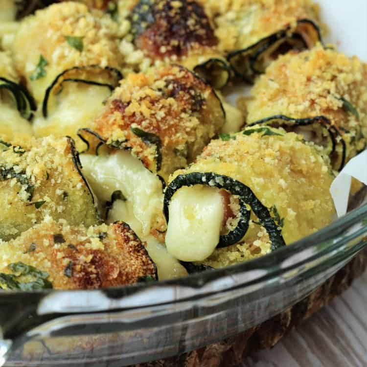Prosciutto and Cheese Zucchini Roll Ups in baking dish.