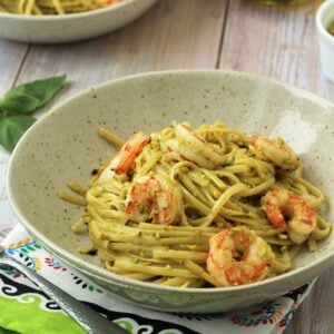 Plated pistachio pesto shrimp pasta.