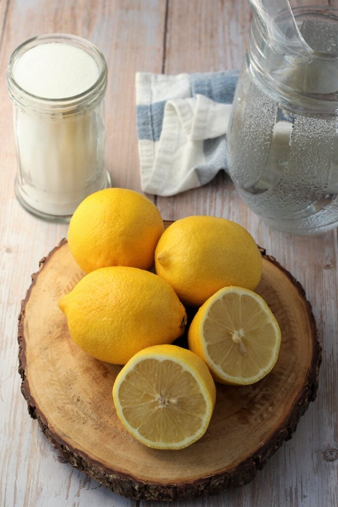 Lemons, sugar and pitcher of water.