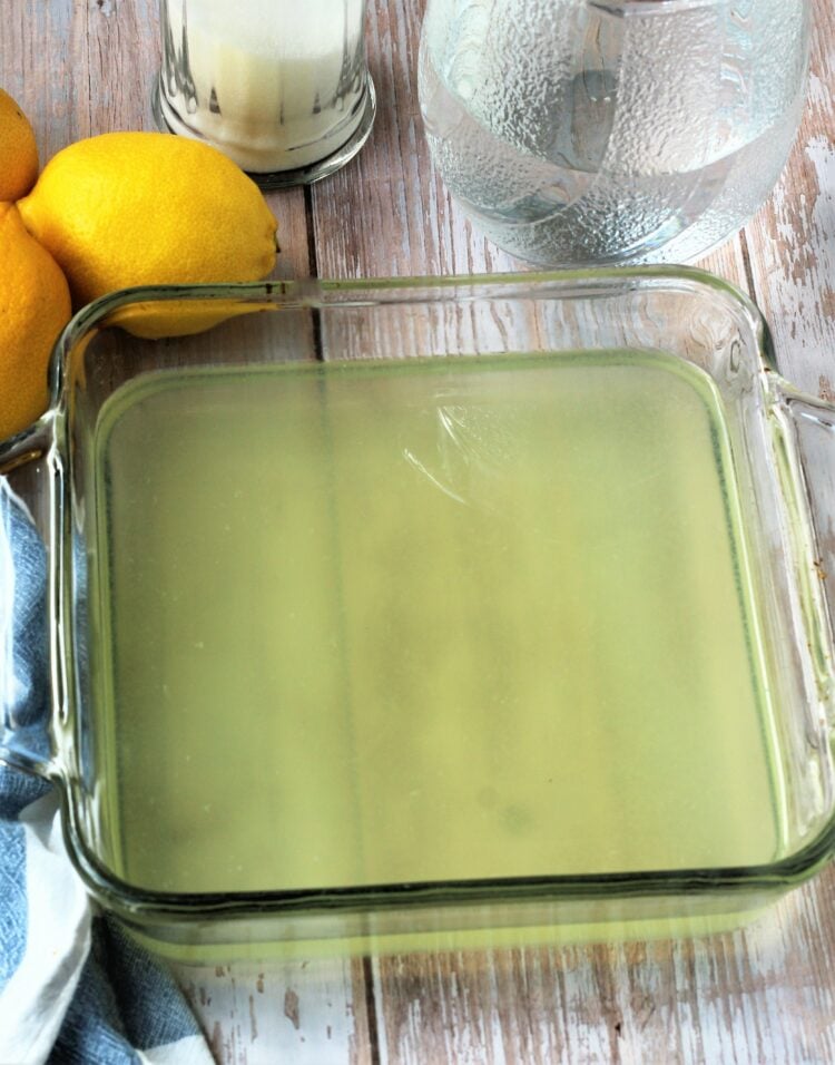 Lemon simple syrup in glass plate for granita.
