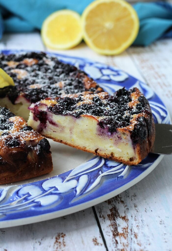 Slice of blueberry ricotta cake on spatula.