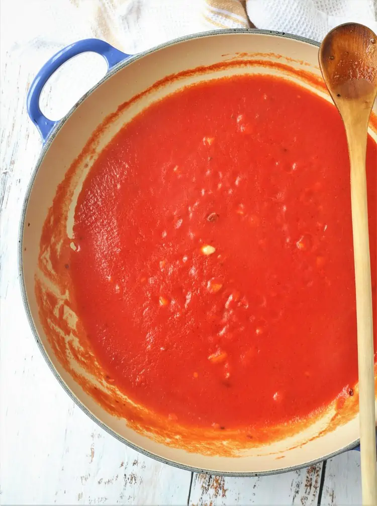 Tomato sauce simmering in skillet.