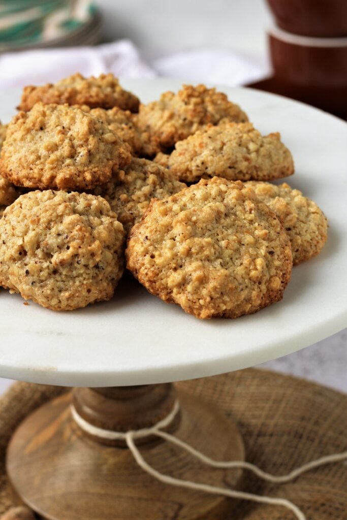 Flourless hazelnut cookies on cake stand.