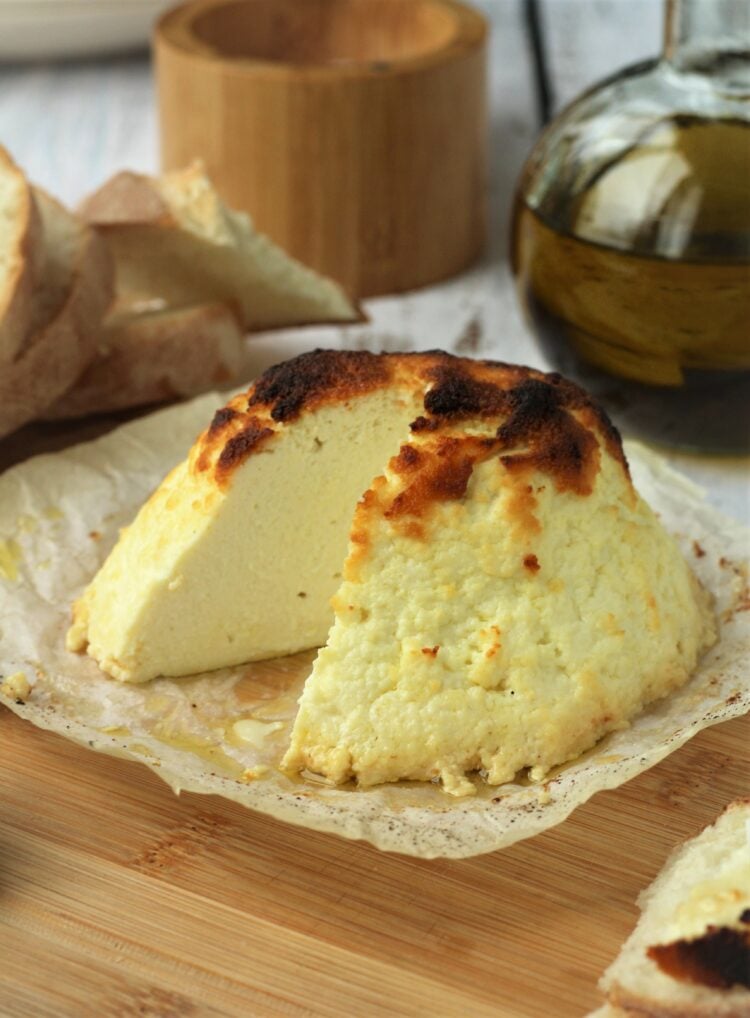 Sicilian baked ricotta on wood board.