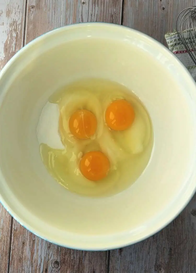 Eggs and sugar in large mixing bowl.