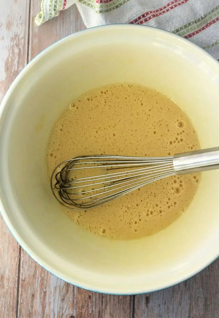 Whisked eggs and sugar in mixing bowl.