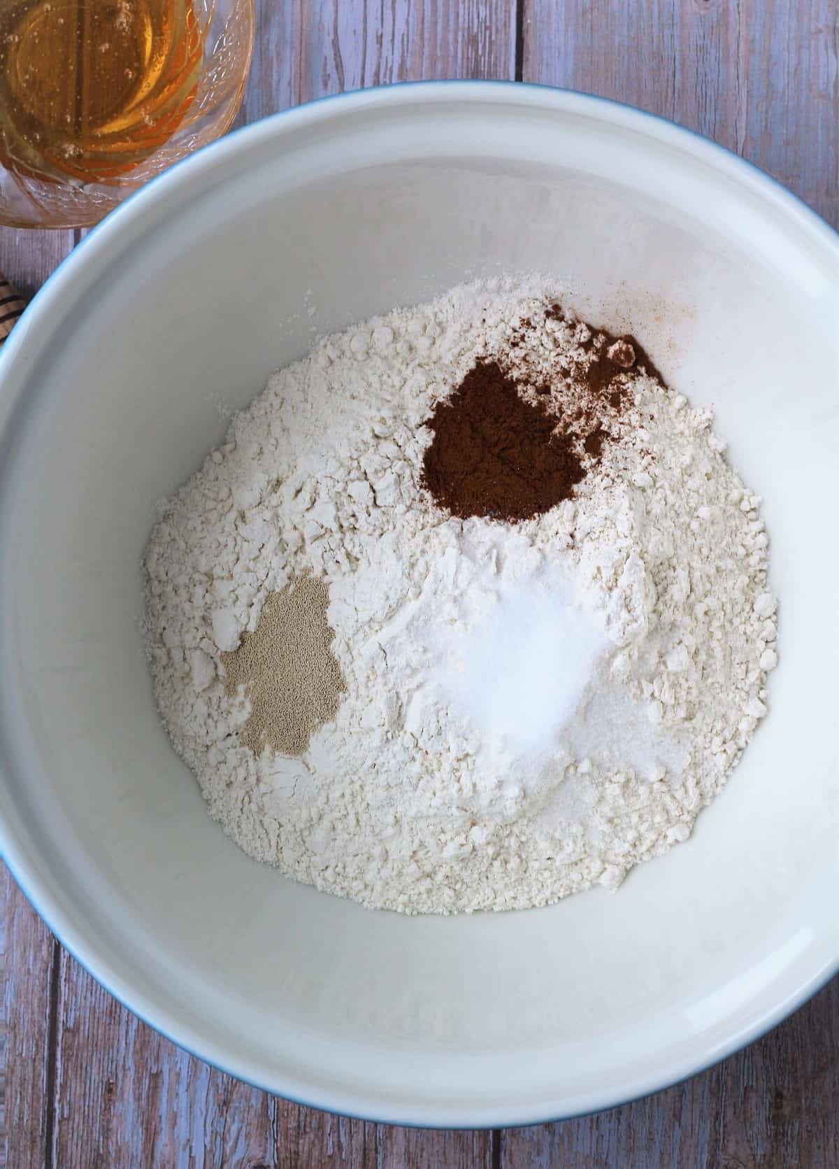 Dry ingredients for fig walnut bread in bowl.