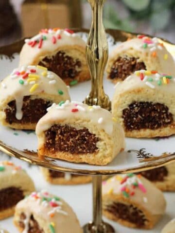 Sicilian fig cookies, cuccidati, on tiered cookie plate.