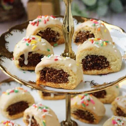 Sicilian fig cookies, cuccidati, on tiered cookie plate.