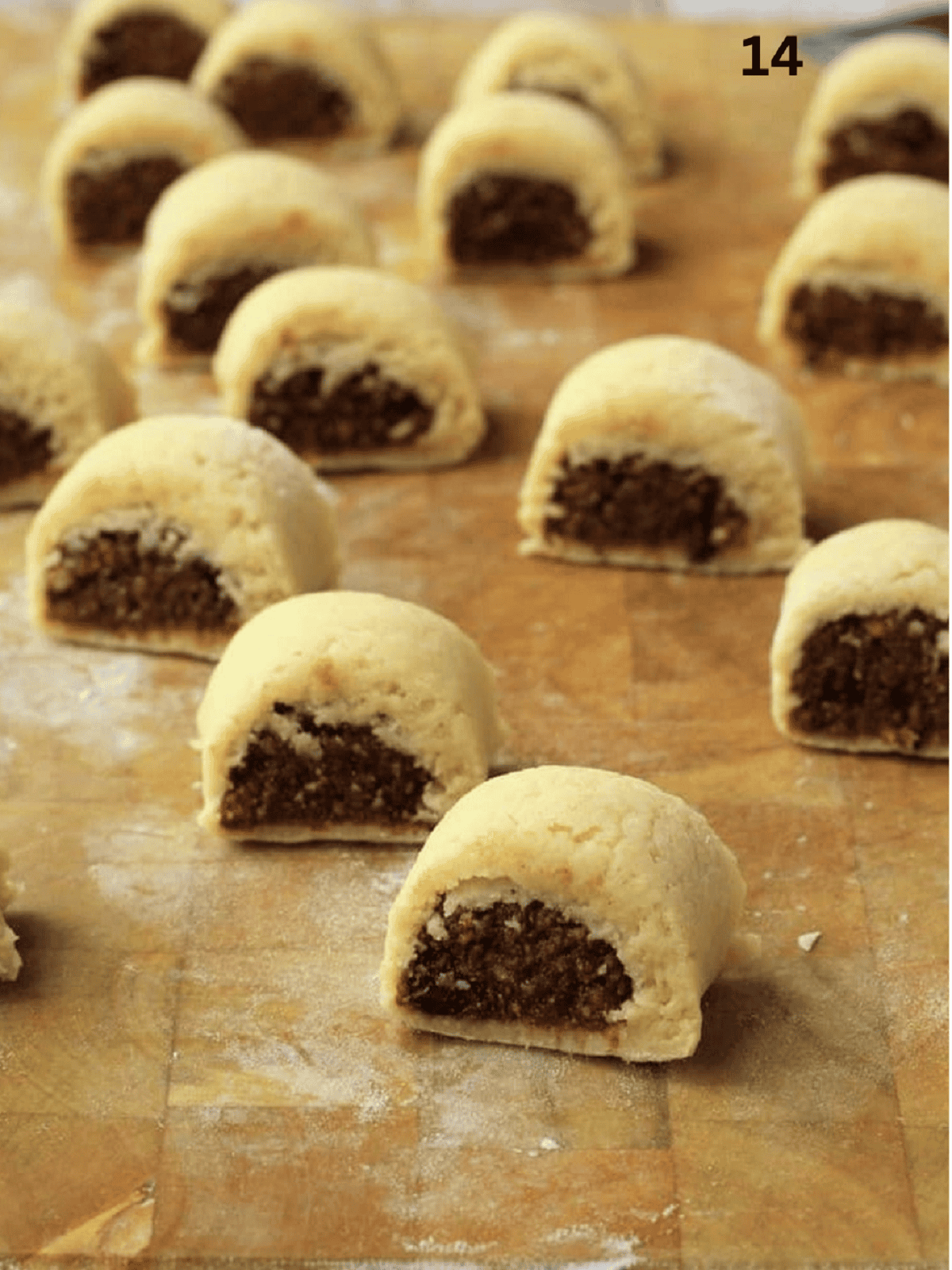 Shaped fig cookies on wood board.